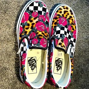 Vans slip on white with checkerboard colors , roses and leopard